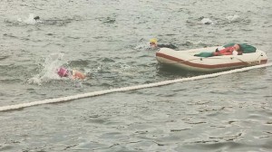 For swims, Dick literally tows his son behind him in a custom-built raft as he cuts through 2+ miles of waves