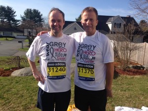 Barry and Tommy Scanlon wearing matching t-shirts to honor their sister Sue, who inspired their running