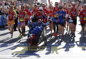 Absolutely nothing can deter these two, however, so Dick - now 74 years young - rallied and pushed Rick in this year's 2014 running. Team Hoyt (pictured) was the largest group to ever cross a marathon finish line simultaneously in marathon history.
